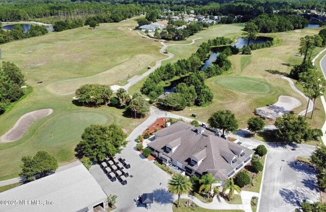 615 Fairway Dr Unit 202, Saint Augustine, FL 32084 - drone / aerial view of a large body of water and a golf club