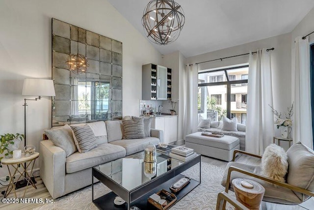 726 Spinnakers Reach Dr Unit 726, Ponte Vedra Beach, FL 32082 - living area with a notable chandelier, a healthy amount of sunlight, lofted ceiling, and light wood-style floors
