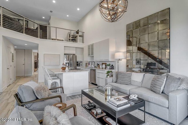 726 Spinnakers Reach Dr Unit 726, Ponte Vedra Beach, FL 32082 - living area featuring recessed lighting, baseboards, a chandelier, and a towering ceiling