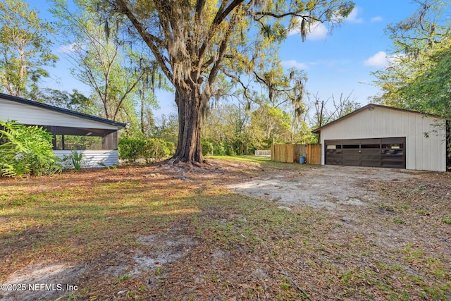 6211 Firestone Rd, Jacksonville, FL 32244 - view of yard featuring an outdoor structure, an outbuilding, and a garage