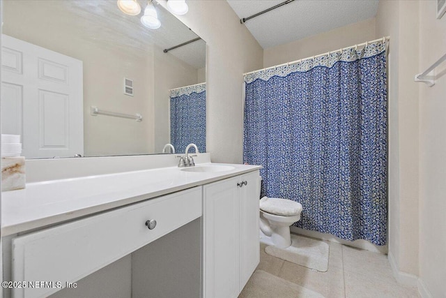 10000 Gate Pkwy Unit 714, Jacksonville, FL 32246 - full bathroom featuring visible vents, toilet, vanity, tile patterned floors, and a textured ceiling