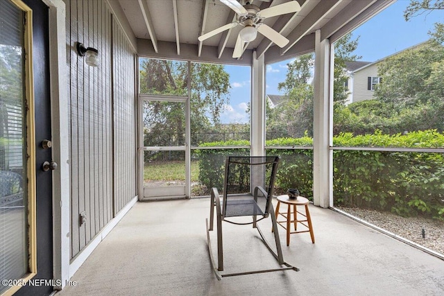 10000 Gate Pkwy Unit 714, Jacksonville, FL 32246 - unfurnished sunroom featuring beamed ceiling, plenty of natural light, and a ceiling fan
