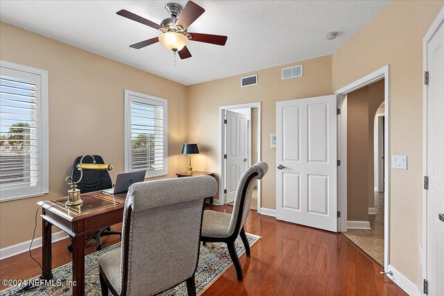 116 19th Ave N Unit 301, Jacksonville Beach, FL 32250 - office featuring visible vents, wood finished floors, arched walkways, and ceiling fan