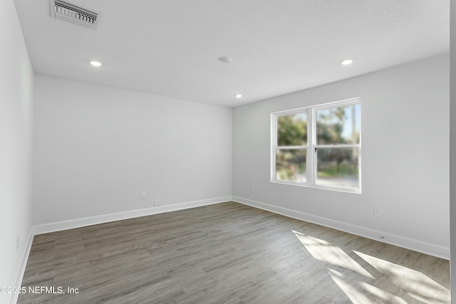 1539 E 26th St, Jacksonville, FL 32206 - empty room with visible vents, recessed lighting, baseboards, and wood finished floors