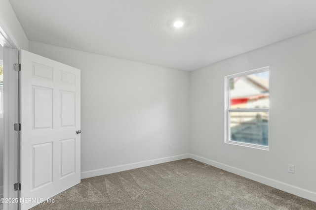 1539 E 26th St, Jacksonville, FL 32206 - carpeted empty room with baseboards