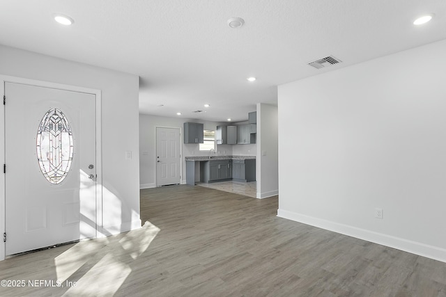 1539 E 26th St, Jacksonville, FL 32206 - entrance foyer featuring light wood finished floors, visible vents, recessed lighting, and baseboards
