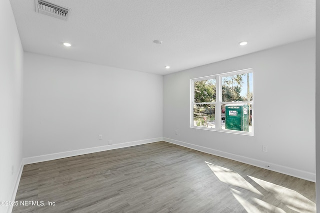 1539 E 26th St, Jacksonville, FL 32206 - empty room with visible vents, recessed lighting, baseboards, and wood finished floors