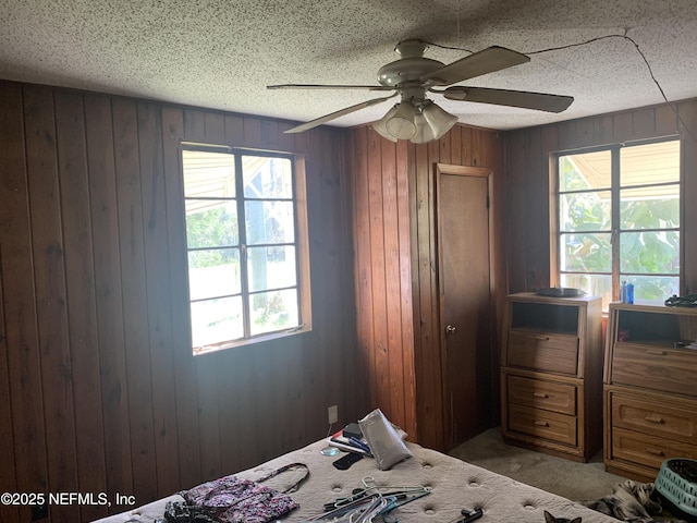 7823 Berry Ave, Jacksonville, FL 32211 - unfurnished bedroom featuring wooden walls, a textured ceiling, and carpet