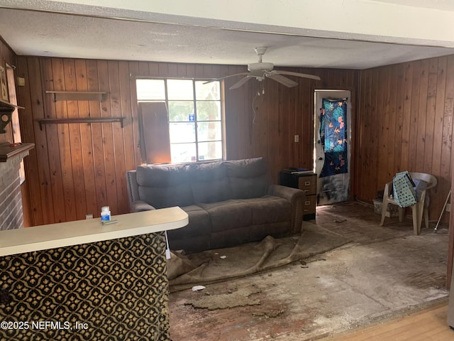 7823 Berry Ave, Jacksonville, FL 32211 - living area featuring a textured ceiling, wooden walls, and ceiling fan
