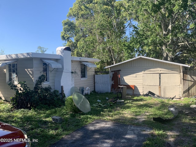7823 Berry Ave, Jacksonville, FL 32211 - view of side of home with a chimney