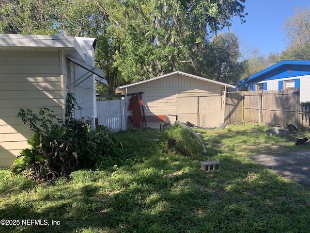 7823 Berry Ave, Jacksonville, FL 32211 - view of yard featuring an outbuilding and fence