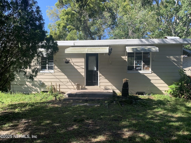 7823 Berry Ave, Jacksonville, FL 32211 - view of front of house featuring a front lawn
