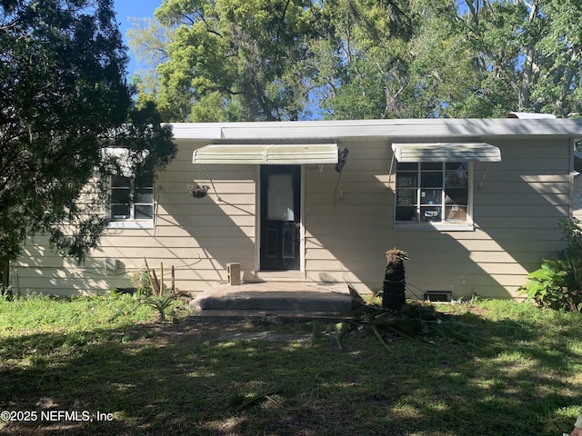 7823 Berry Ave, Jacksonville, FL 32211 - exterior space with a front yard