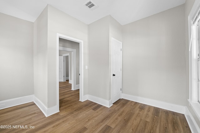 interior space with visible vents, baseboards, and light wood-style floors