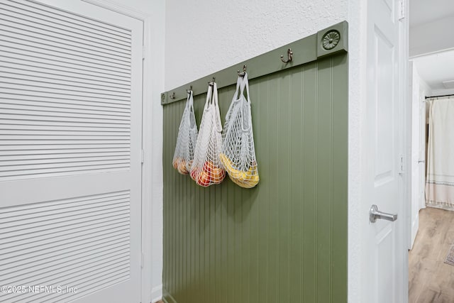 8539 Gate Pkwy W Unit 628, Jacksonville, FL 32216 - mudroom featuring a textured wall and wood finished floors
