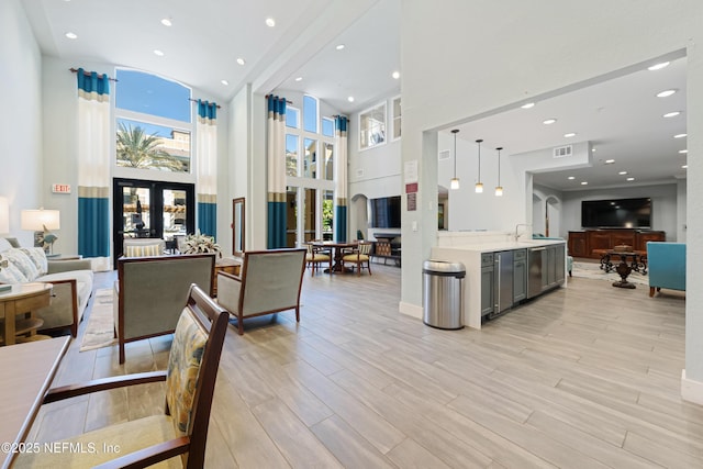 8539 Gate Pkwy W Unit 628, Jacksonville, FL 32216 - interior space featuring light wood-style flooring, visible vents, open floor plan, and light countertops