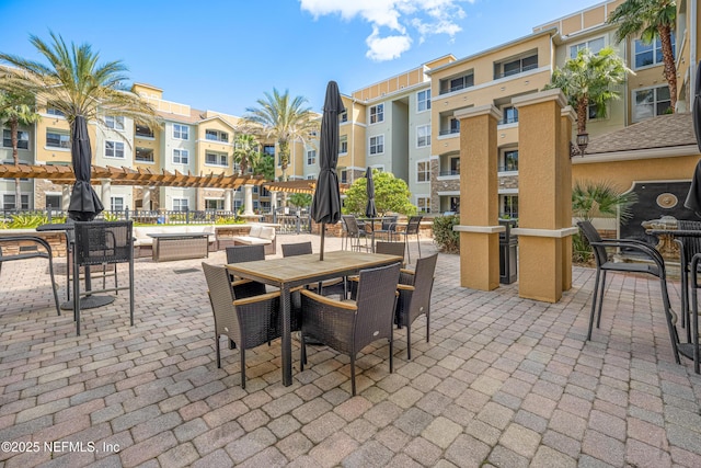 8539 Gate Pkwy W Unit 628, Jacksonville, FL 32216 - view of patio featuring outdoor dining area and a residential view