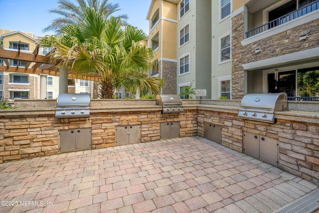 8539 Gate Pkwy W Unit 628, Jacksonville, FL 32216 - view of patio / terrace with an outdoor kitchen and a grill