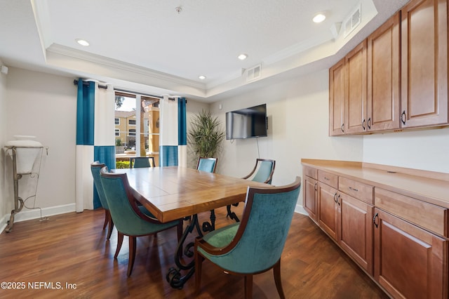 8539 Gate Pkwy W Unit 628, Jacksonville, FL 32216 - dining space with a tray ceiling, visible vents, and dark wood finished floors