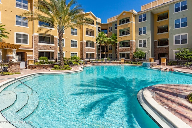 8539 Gate Pkwy W Unit 628, Jacksonville, FL 32216 - pool featuring a patio area and fence