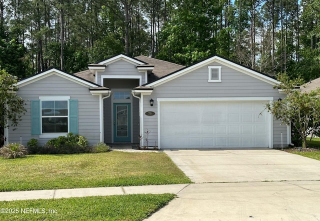 ranch-style home featuring an attached garage, a front lawn, driveway, and view of scattered trees