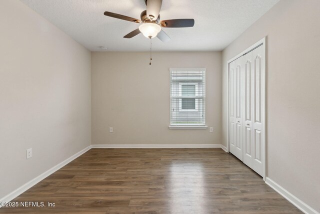 79 Boulder Rock Way, Saint Augustine, FL 32092 - unfurnished bedroom with a closet, wood finished floors, and baseboards