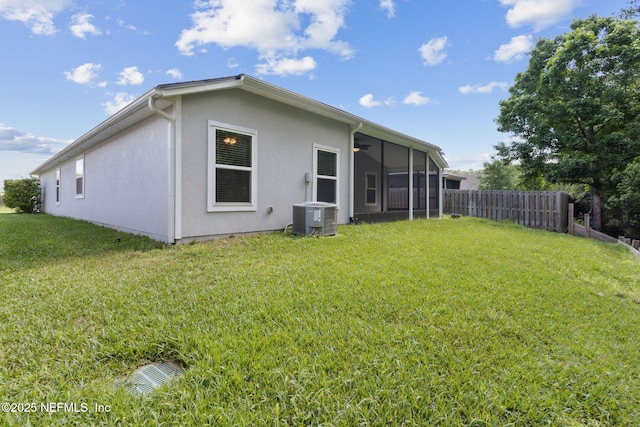 79 Boulder Rock Way, Saint Augustine, FL 32092 - back of house featuring cooling unit, a sunroom, and stucco siding