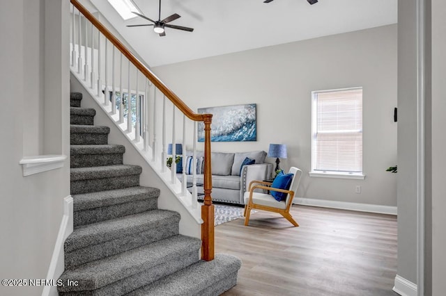 95332 Village Dr, Fernandina Beach, FL 32034 - staircase featuring baseboards, lofted ceiling, a ceiling fan, and wood finished floors