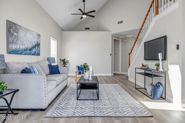 95332 Village Dr, Fernandina Beach, FL 32034 - living room featuring stairway, wood finished floors, visible vents, and ceiling fan