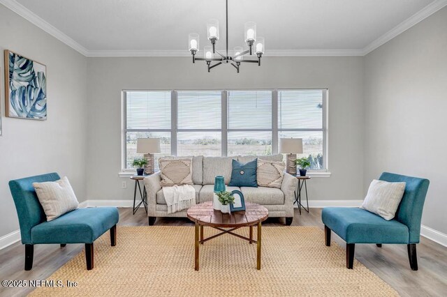 95332 Village Dr, Fernandina Beach, FL 32034 - living room with light wood-style floors, an inviting chandelier, and ornamental molding