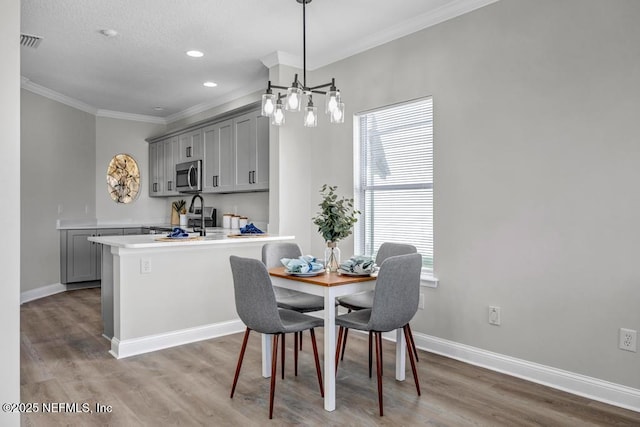 95332 Village Dr, Fernandina Beach, FL 32034 - dining area with light wood-type flooring, baseboards, and a healthy amount of sunlight