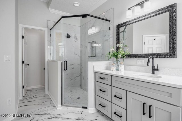 95332 Village Dr, Fernandina Beach, FL 32034 - full bathroom with a marble finish shower, a textured ceiling, marble finish floor, and vanity