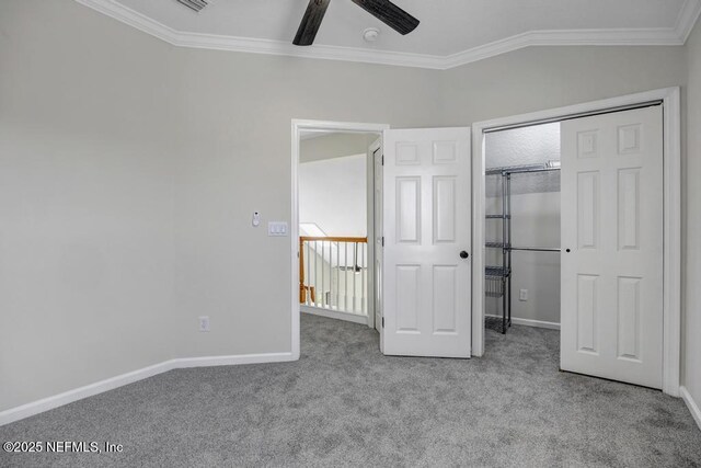 95332 Village Dr, Fernandina Beach, FL 32034 - unfurnished bedroom with crown molding, ceiling fan, baseboards, carpet, and a closet