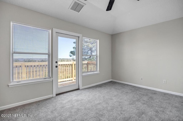 95332 Village Dr, Fernandina Beach, FL 32034 - unfurnished room with visible vents, baseboards, ceiling fan, vaulted ceiling, and carpet flooring