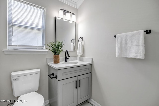 95332 Village Dr, Fernandina Beach, FL 32034 - bathroom with baseboards, toilet, vanity, and crown molding