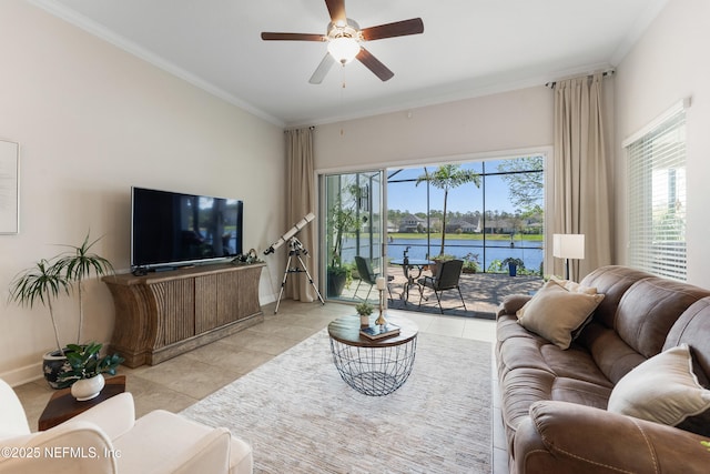 living room featuring a ceiling fan, ornamental molding, baseboards, and tile patterned flooring