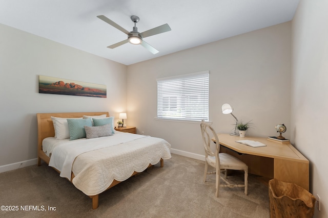 bedroom featuring baseboards, a ceiling fan, and carpet