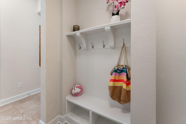 mudroom featuring baseboards and tile patterned flooring