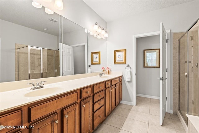 11856 Surfbird Cir Unit 41E, Jacksonville, FL 32256 - bathroom with tile patterned floors, a sink, double vanity, and a shower stall