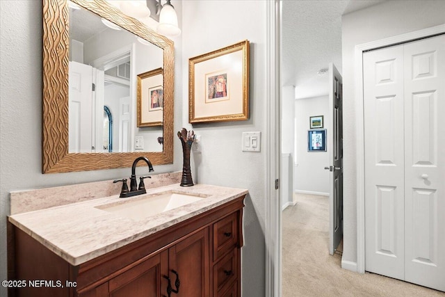 11856 Surfbird Cir Unit 41E, Jacksonville, FL 32256 - bathroom with baseboards, a textured ceiling, and vanity