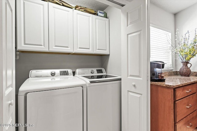 11856 Surfbird Cir Unit 41E, Jacksonville, FL 32256 - laundry room featuring washer and clothes dryer and cabinet space