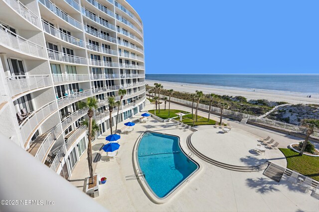 1601 Ocean Dr S Unit 410, Jacksonville Beach, FL 32250 - community pool featuring view of water and beach and a patio area