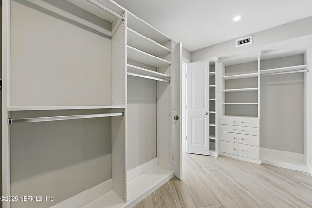 1601 Ocean Dr S Unit 410, Jacksonville Beach, FL 32250 - spacious closet featuring wood finished floors