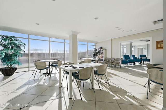 1601 Ocean Dr S Unit 410, Jacksonville Beach, FL 32250 - dining area with light tile patterned flooring and expansive windows