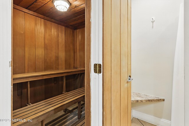 1601 Ocean Dr S Unit 410, Jacksonville Beach, FL 32250 - sauna featuring wood ceiling, tile patterned flooring, and baseboards