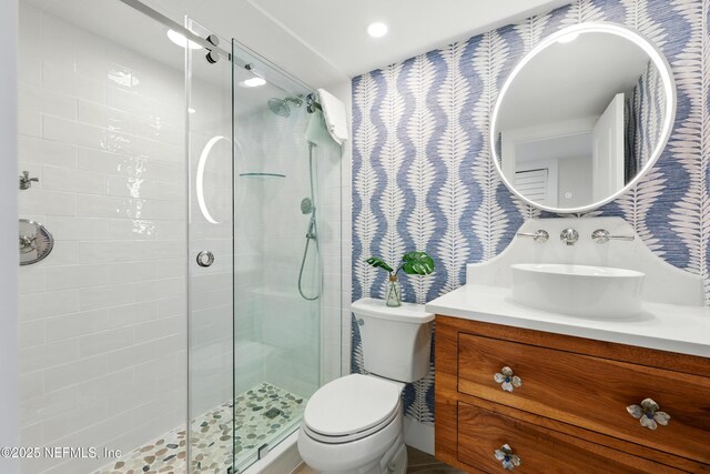 1601 Ocean Dr S Unit 410, Jacksonville Beach, FL 32250 - bathroom with a shower stall, vanity, and toilet