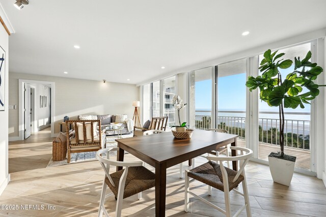 1601 Ocean Dr S Unit 410, Jacksonville Beach, FL 32250 - dining room featuring a water view, light wood-type flooring, and recessed lighting