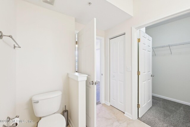 10435 Midtown Pkwy Unit 448, Jacksonville, FL 32246 - bathroom with visible vents, baseboards, and toilet