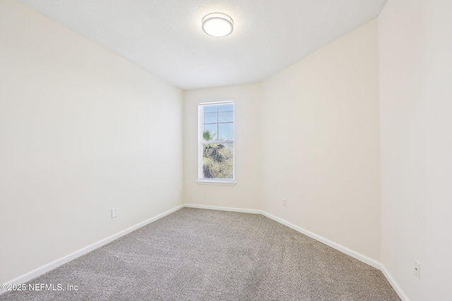 10435 Midtown Pkwy Unit 448, Jacksonville, FL 32246 - unfurnished room featuring baseboards and carpet