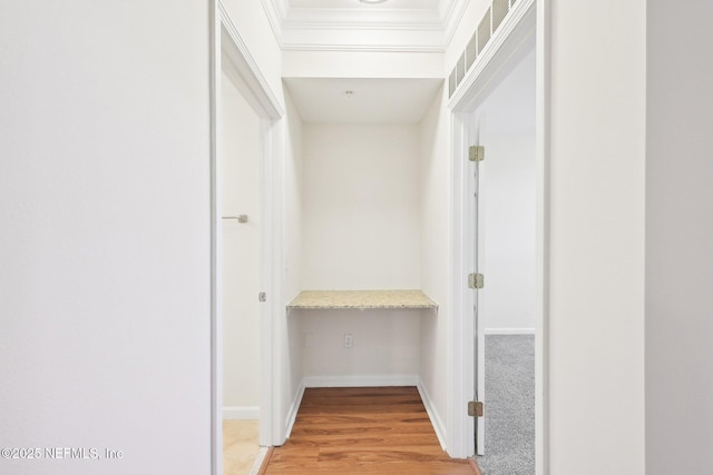 10435 Midtown Pkwy Unit 448, Jacksonville, FL 32246 - hallway with crown molding, baseboards, and light wood-style floors